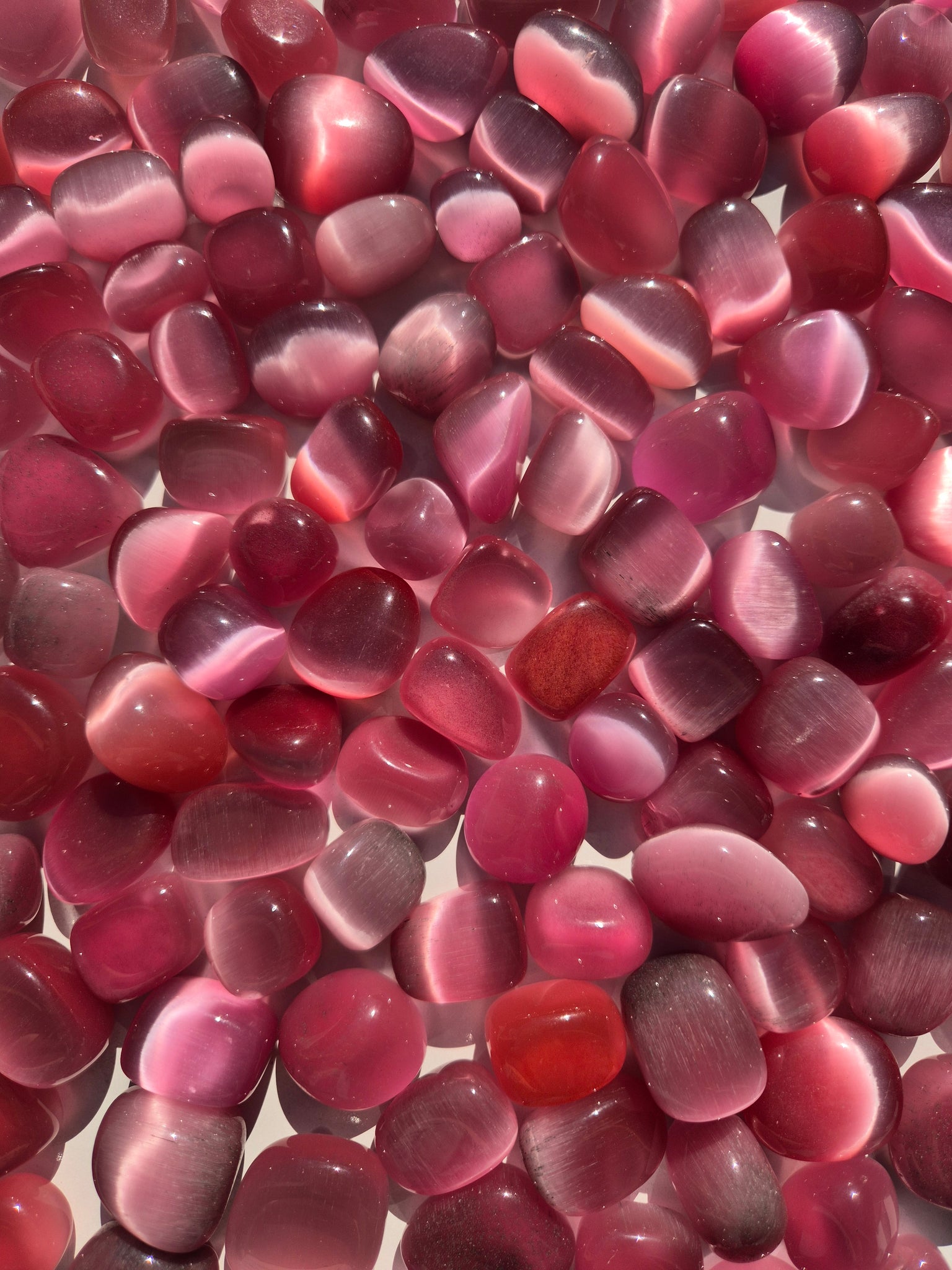 Cats Eye Pink Tumbled Stones